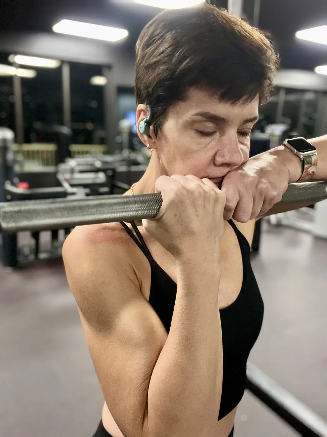 Yvette catching her breath between hard sets at the gym
